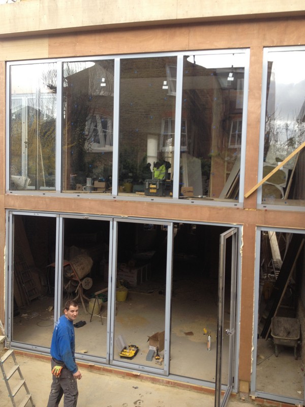 Aluminium bi-fold doors with two-storey glazing in Olney