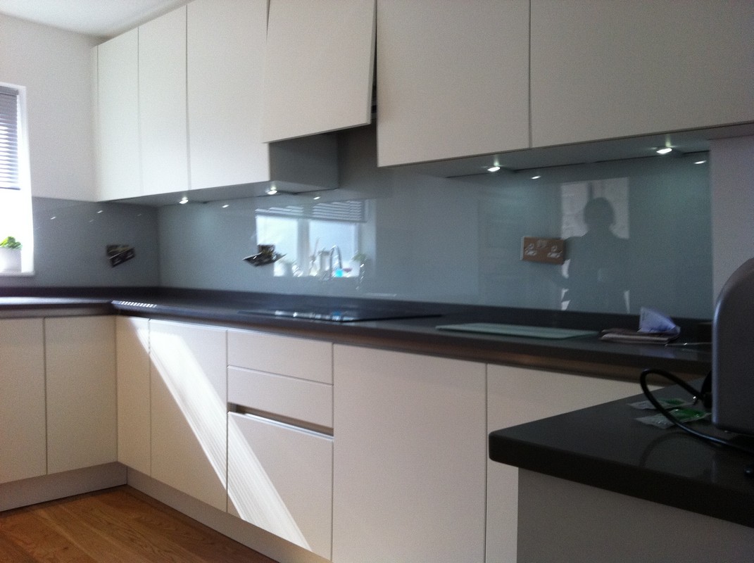 Grey glass kitchen splashback with LED lighting in Olney