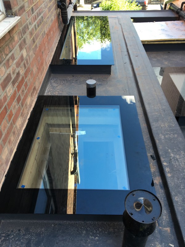 Multiple flat roof skylights on extension in Olney
